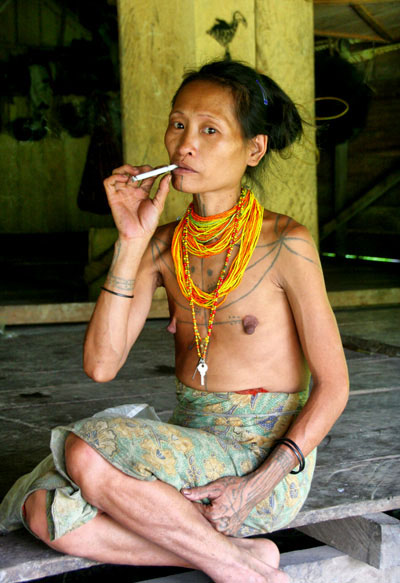 woman tattoo Hiking the mentawai islands on a budget