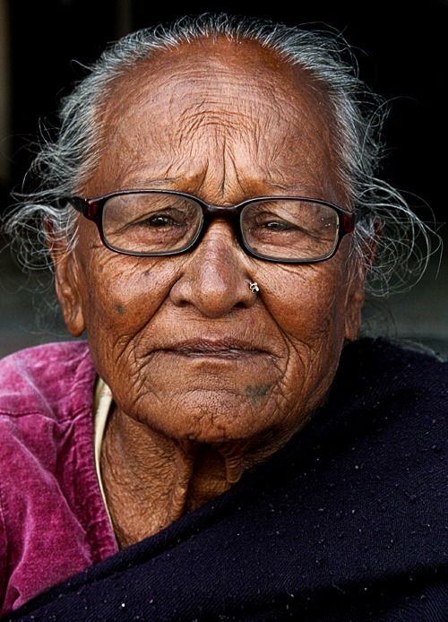 woman boudhanath best places to visit in kathmandu