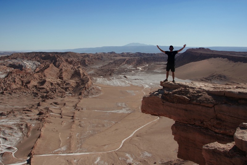 man standing on a cliff